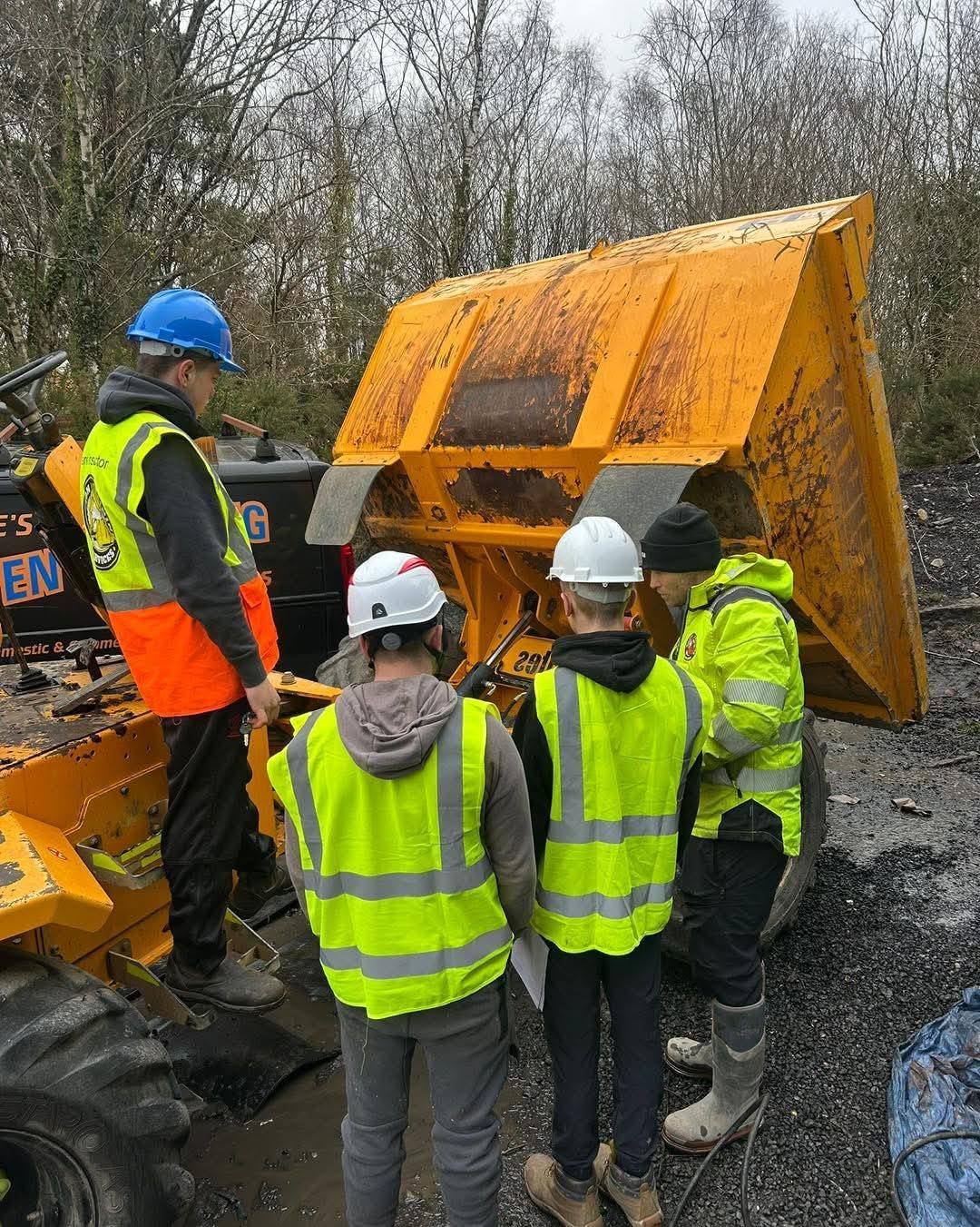 Trainees being assessed around a dumper on site